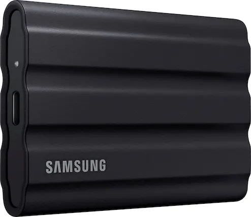 Front. Samsung - T7 Shield 1TB, External USB 3.2 Gen 2 Rugged SSD IP65 Water Resistant - Black.