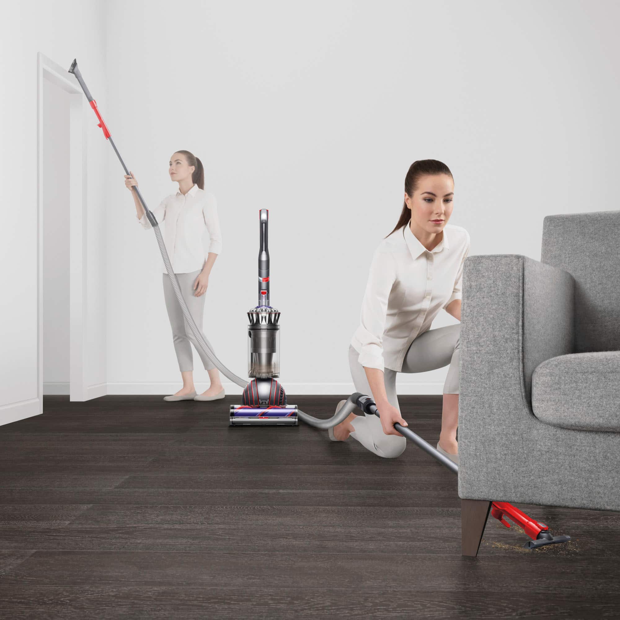 The image shows a woman cleaning a living room with a vacuum cleaner. She is kneeling down on the floor and using the vacuum to clean the carpet. The image also includes a diagram that explains the different cleaning techniques, such as cleaning up high, cleaning everywhere in-between, and cleaning down low. The woman in the image is following the cleaning techniques by vacuuming the floor and the furniture in the living room.