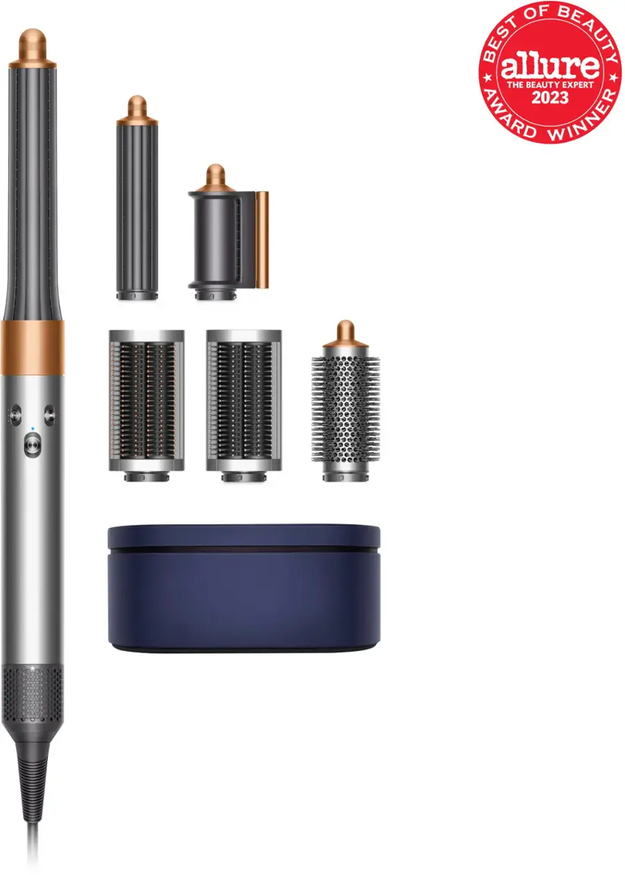 The image features a hair styling tool, which appears to be a hair dryer, along with several attachments. The hair dryer is the largest object in the image, occupying a significant portion of the frame. The attachments are placed around the hair dryer, showcasing the versatility of the device. The image is likely promoting the hair styling tool and its various attachments as a beauty product.