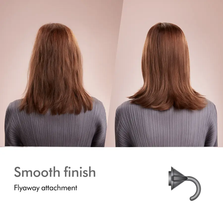 The image showcases a woman with a short hairstyle, which is described as a "smooth finish" and "flyaway attachment." This suggests that the hairstyle is neat and well-groomed, with a slight flyaway effect that adds a natural and casual touch to the overall appearance. The woman's hair is styled in a way that balances both the smoothness and the flyaway effect, making it an appealing and attractive hairstyle.