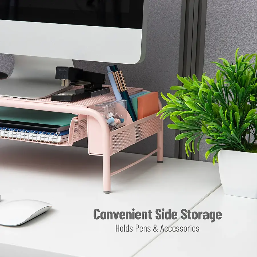 The image features a white desk with a pink tray on top of it, which holds pens and accessories. The desk also has a computer monitor and a keyboard. The desk setup is organized and efficient, providing a convenient side storage solution for the user.