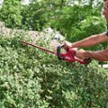 Left. Skil - PWRCORE 20 20-Volt 22-Inch Hedge Trimmer (1 x 2.0Ah Battery and 1 x Charger) - Red/black.