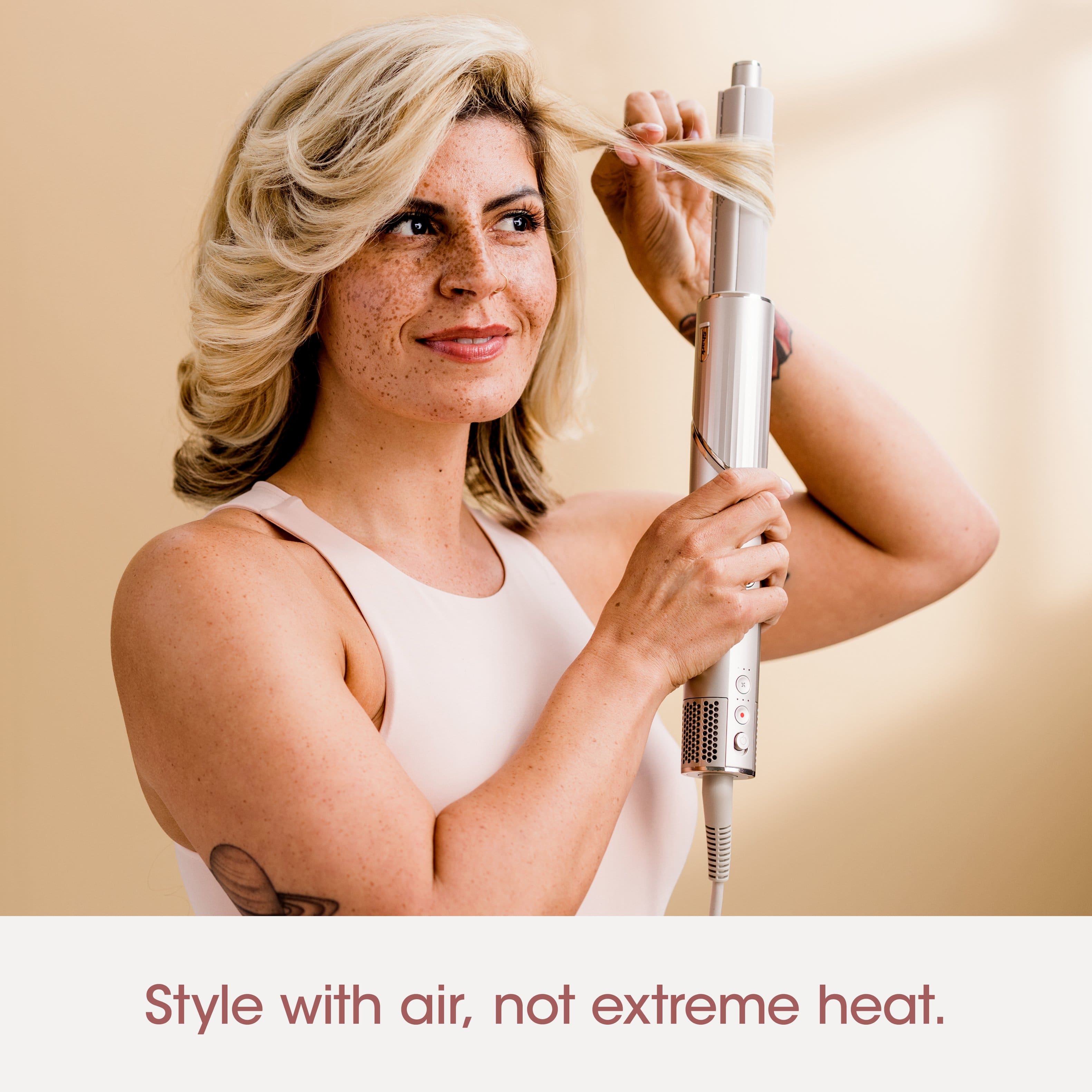 The image features a woman with blonde hair, wearing a white dress, and holding a hair dryer. The woman is smiling, possibly enjoying her time or the process of styling her hair. The text "Style with air, not extreme heat" suggests that using a hair dryer can be a more pleasant and less damaging way to style hair compared to using extreme heat.