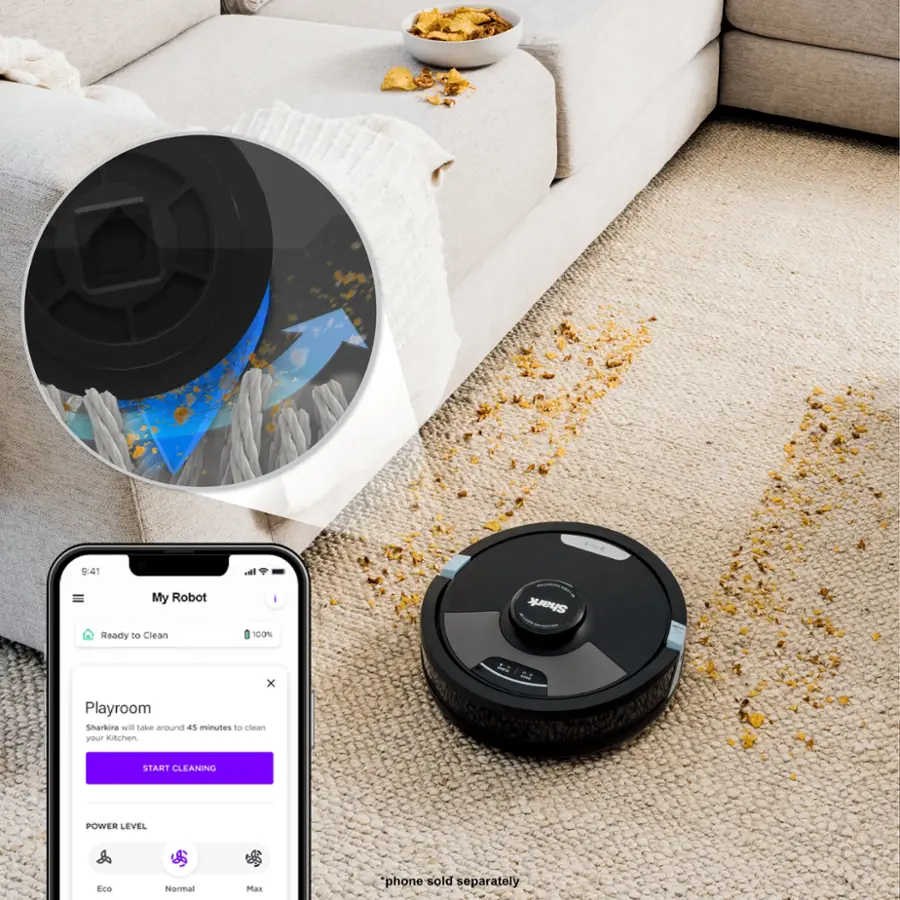 The image shows a robotic vacuum cleaner on a carpeted floor, with a cell phone displaying the robot's status. The robotic vacuum is designed to clean your home, including the playroom, and it can take around 100% of the time to clean your kitchen. The vacuum is equipped with different power levels, including Eco, Normal, and Max, to suit various cleaning needs. The cell phone app allows you to monitor and control the robotic vacuum from your phone, making it a convenient and efficient cleaning solution.