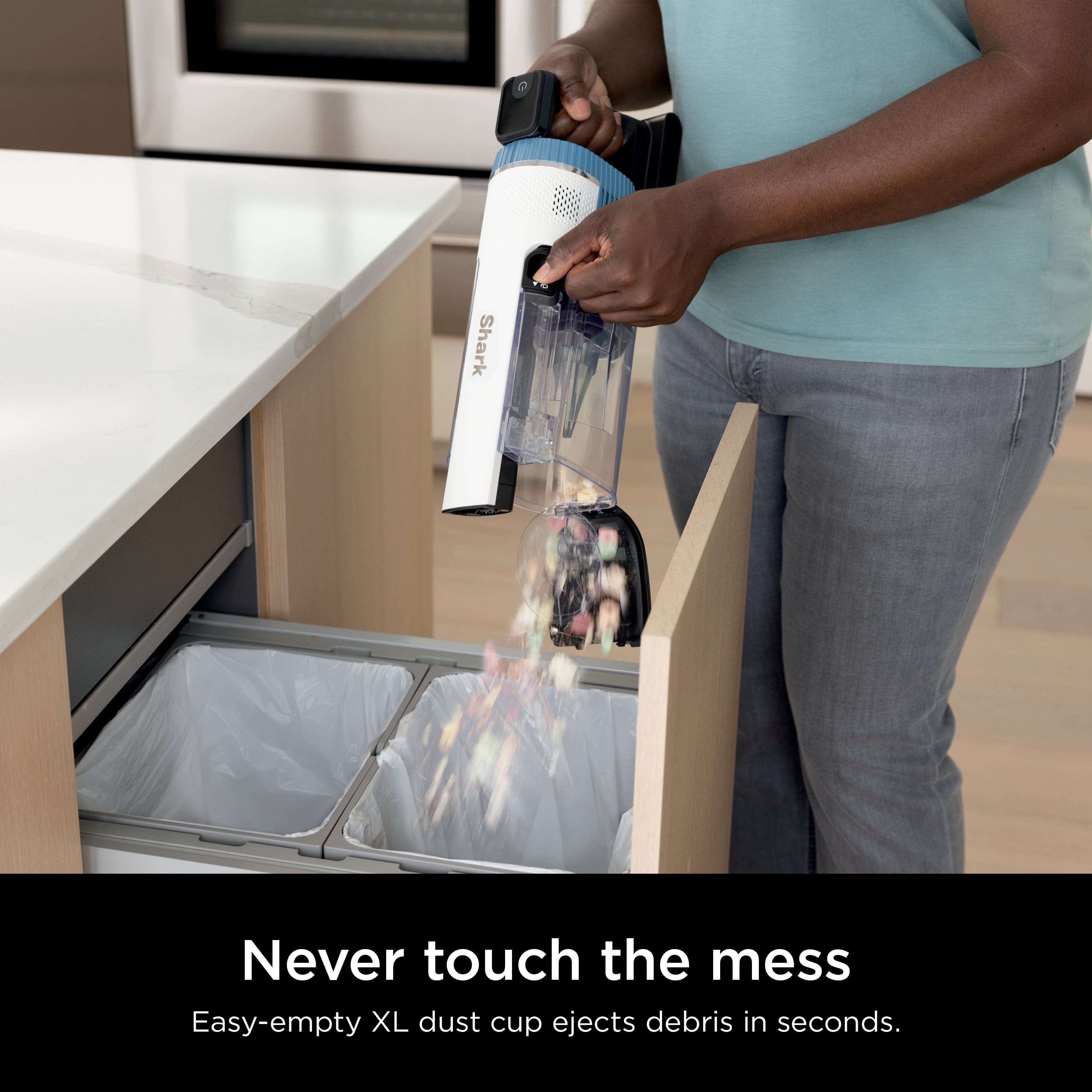 Shark Never touch the mess Easy-empty XL dust cup ejects debris in seconds.