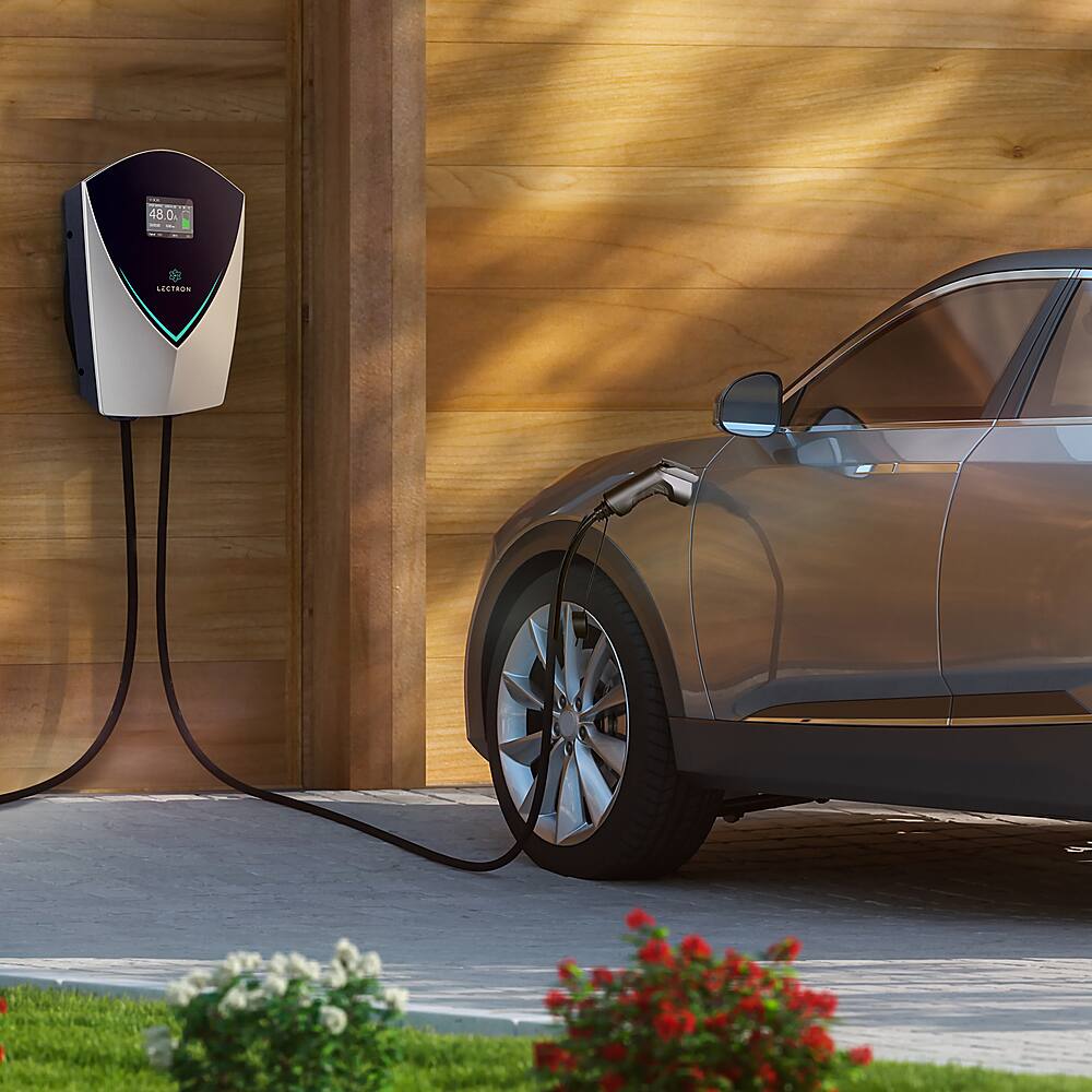 The text on the image reads "48.0 I - ASTRAN." This is likely an error or a misinterpretation of the text. The correct text should be "48.0 Ampere - Astron," which indicates that the car is being charged with 48.0 amperes of current from the Astron charger.