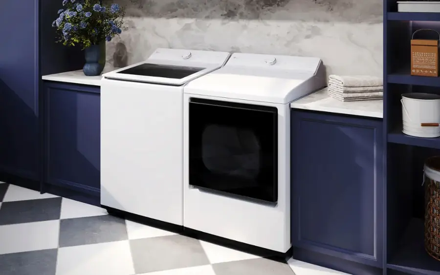 The text on the image reads "Maruwursing - - - Mumereepins - - - + - - :  :  : :  1 3 & A A A A." However, it is not clear what this text represents or how it relates to the image of the kitchen with a washer and dryer.