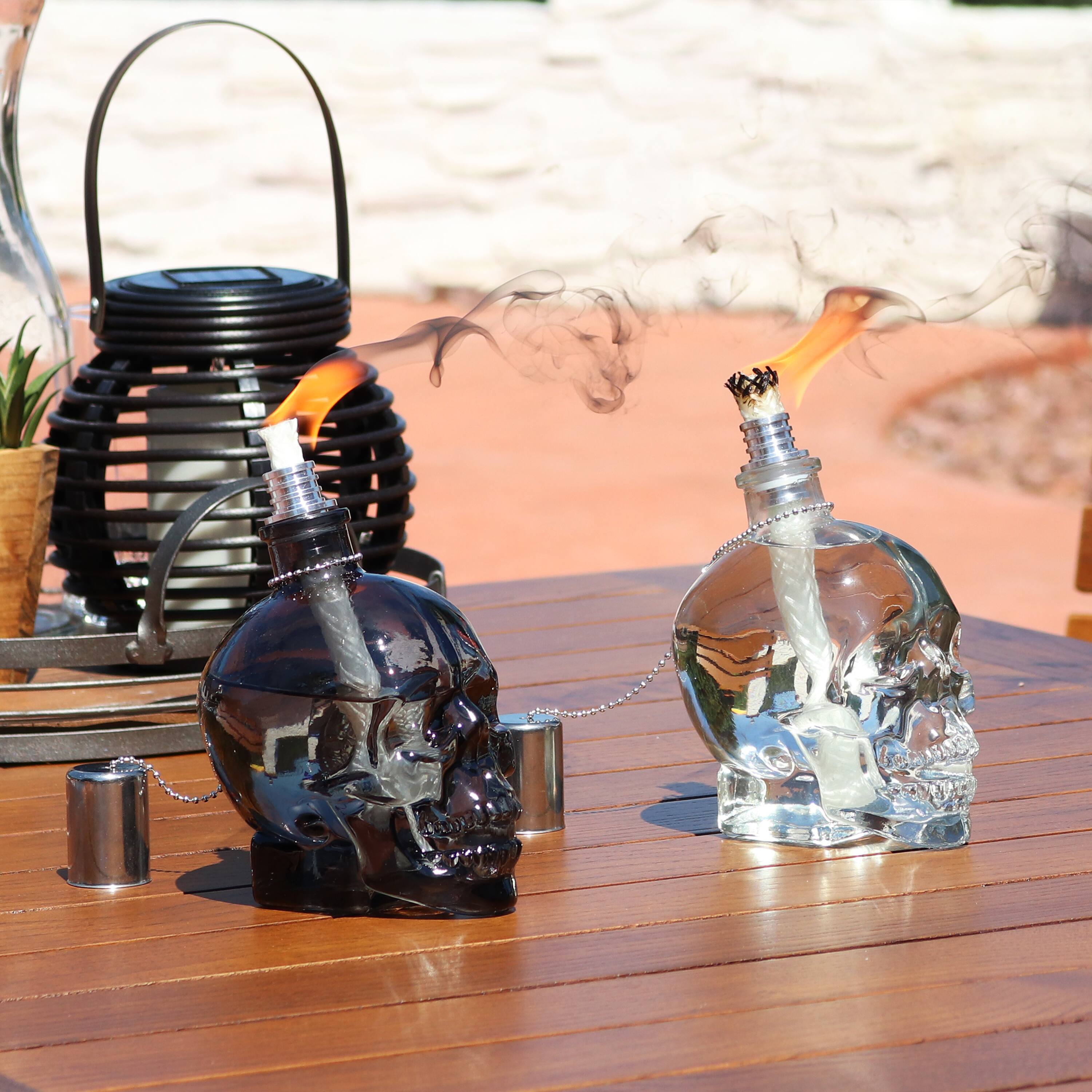 Alt View 4. Sunnydaze - Set of 4 Glass/Metal Grinning Skull Tabletop Torch - Black/Clear.