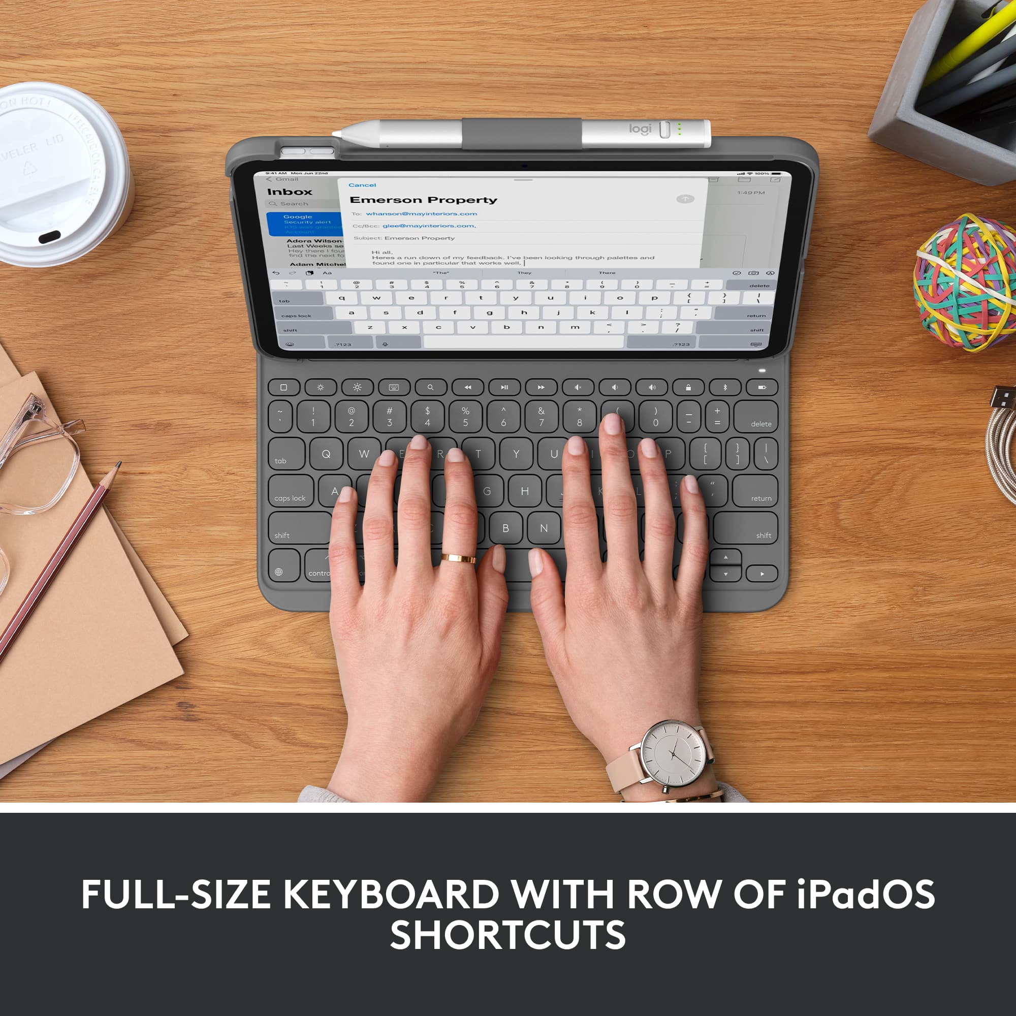 Full-size keyboard with row of iPadOS shortcuts.