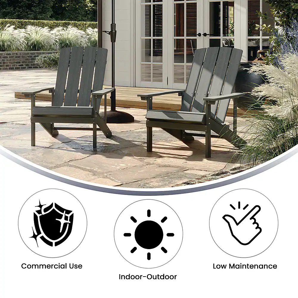 The image features two wooden lawn chairs placed on a patio, with a house in the background. The chairs are positioned close to each other, and there is a bench nearby. The scene suggests a comfortable outdoor seating area for relaxation or socializing. The chairs are made of wood, which indicates that they are suitable for both commercial and residential use. The low maintenance aspect of the chairs implies that they are easy to clean and maintain, making them a practical choice for outdoor spaces. The indoor-outdoor aspect of the chairs suggests that they can be used in both indoor and outdoor settings, providing versatility and convenience for the users.