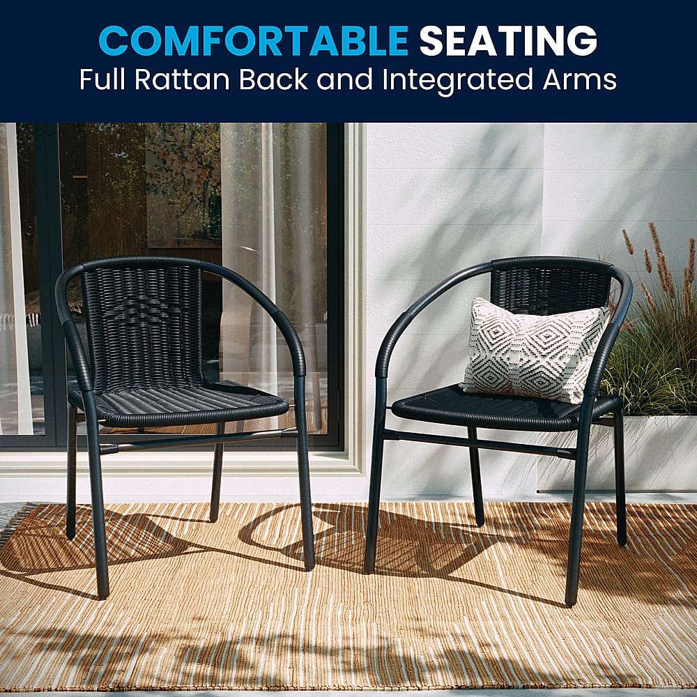 The image features two black wicker chairs with integrated arms, placed on a rug. The chairs are comfortable and suitable for outdoor use, providing a relaxing seating option for people to enjoy the outdoors. The chairs are positioned next to each other, creating a cozy and inviting atmosphere.