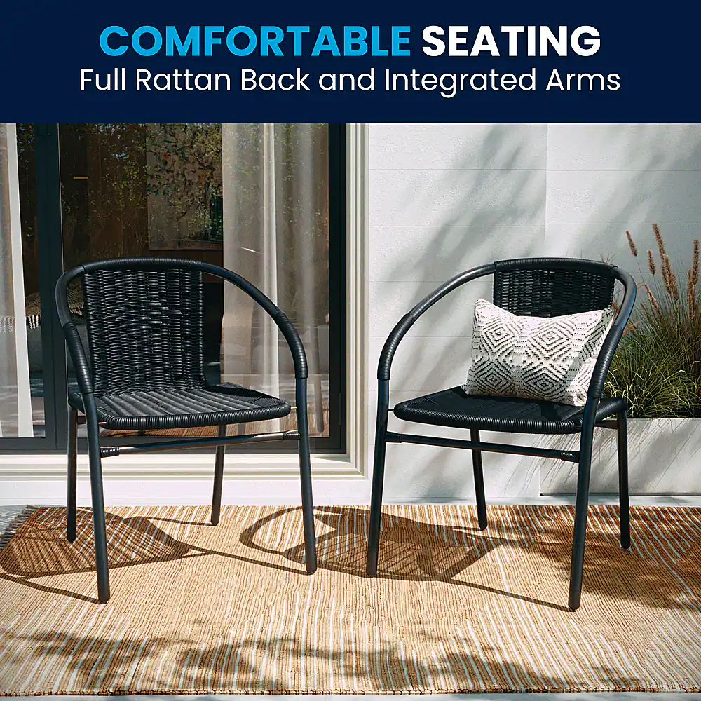 The image features two black wicker chairs with integrated arms, placed on a rug. The chairs are comfortable and suitable for outdoor use, providing a relaxing seating option for people to enjoy the outdoors. The chairs are positioned next to each other, creating a cozy and inviting atmosphere.