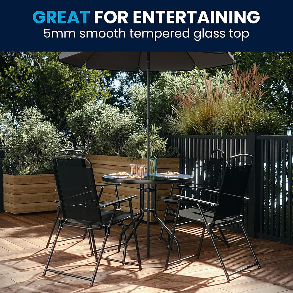 The image features a wooden deck with a dining table and four chairs arranged around it. The table is topped with a 5mm smooth tempered glass top, making it suitable for entertaining guests. The chairs are positioned in a way that encourages conversation and interaction among the people seated. The outdoor setting with the glass table and chairs creates a pleasant atmosphere for social gatherings and enjoying meals together.