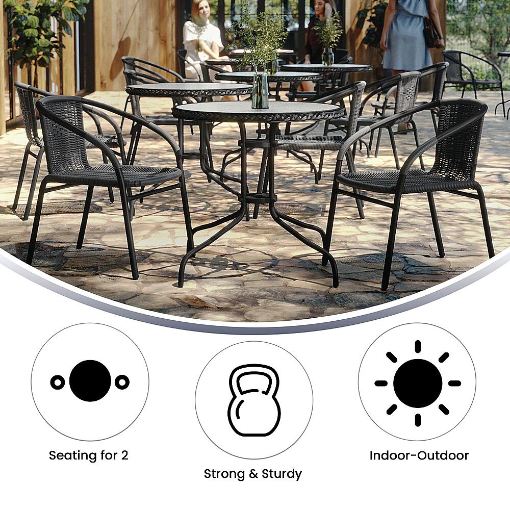 The image features a large dining table surrounded by several chairs, with a total of 10 chairs visible. The table is set up for outdoor use, and the chairs are designed to be strong and sturdy. The table is positioned in a patio setting, and there are also potted plants nearby, adding to the outdoor ambiance.