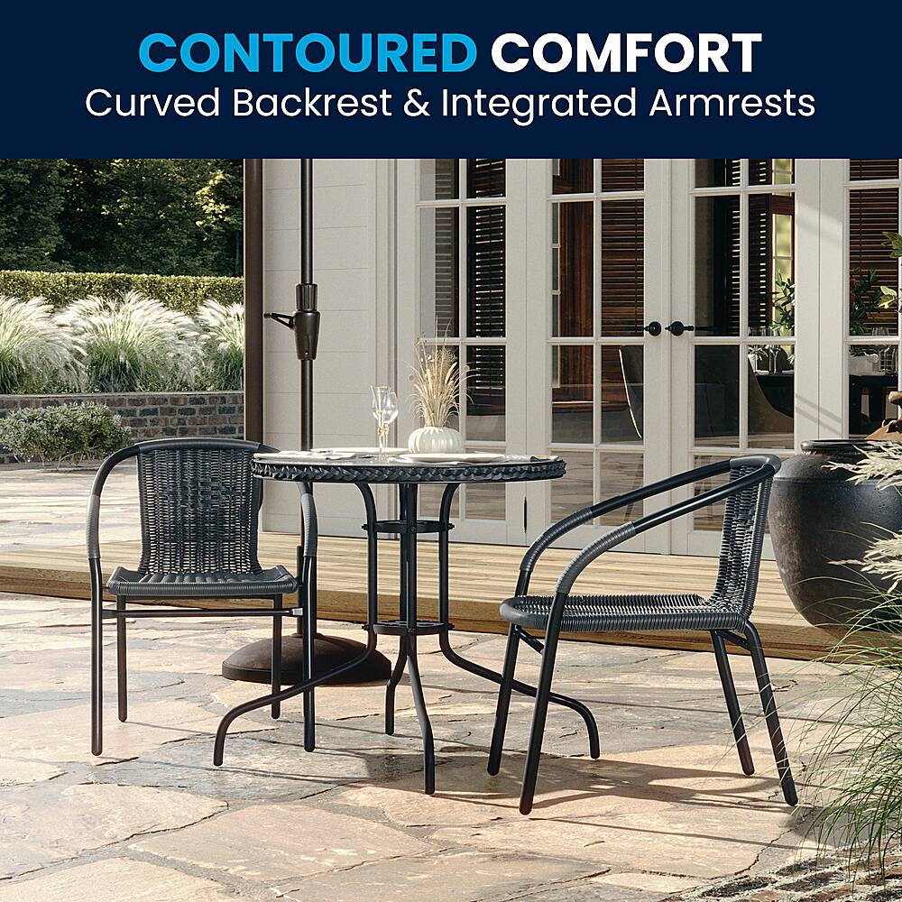 The image features a patio setting with a dining table and chairs. The table is accompanied by two chairs, one on the left and the other on the right. The chairs have curved backrests and integrated armrests, providing a comfortable and relaxing seating experience. The table is set with wine glasses and a vase, adding to the inviting atmosphere of the outdoor space.