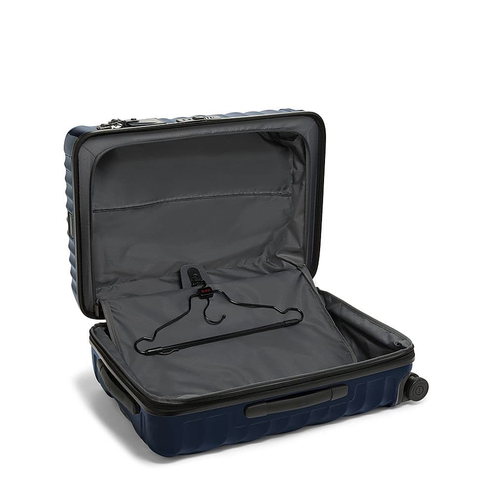 Left View: TUMI - Short Trip 18" Expandable 4 Wheeled Spinner Suitcase - Navy