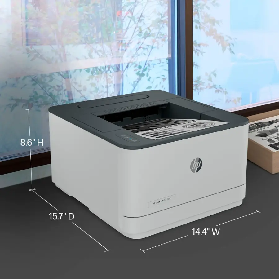 The text on the image reads "8.6" H - hp me 3021 - Lasere 15.7" D 14.4" W." This text is describing the dimensions of a printer, specifically the HP Me 3021. The printer is 8.6 inches tall, has a 15.7-inch depth, and a 14.4-inch width.