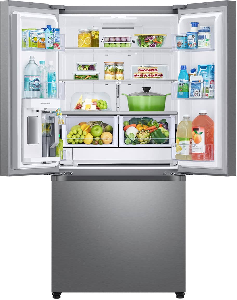 The refrigerator is full of food and drinks, including fruits and vegetables.
