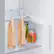 The image shows a refrigerator with two bottles of wine and a jar of pickles inside. The refrigerator is a Samsung model with a capacity of 10 liters. The wine bottles are placed on the middle shelf, while the jar of pickles is located on the bottom shelf.