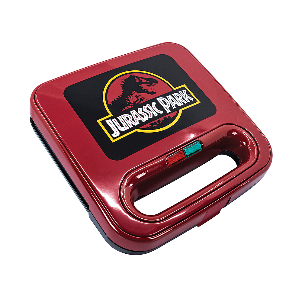 Left View: Uncanny Brands Jurassic Park Grilled Cheese Maker  a Jurassic Park Kitchen Appliance - Red