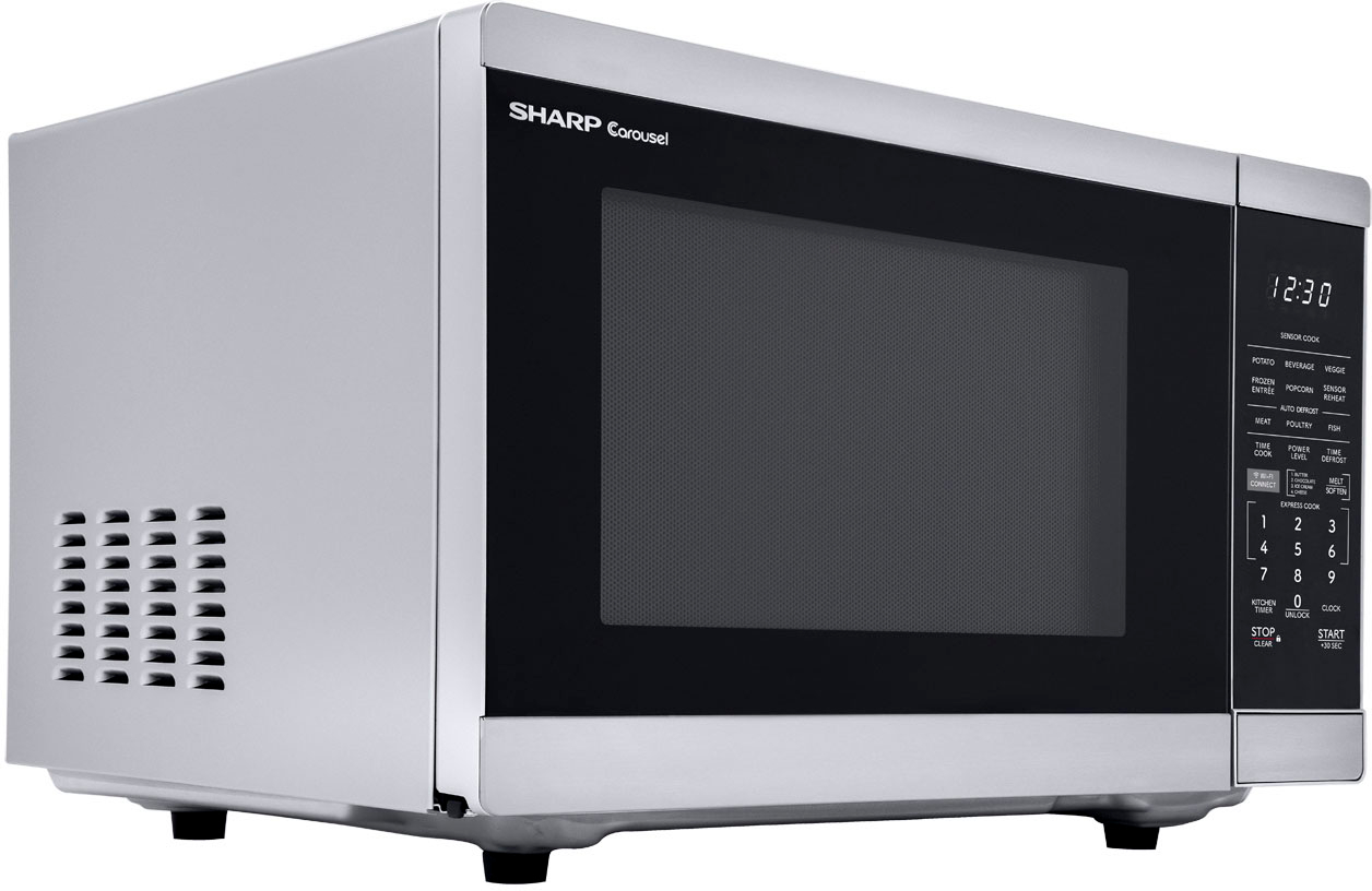 Left View: GE - 0.9 Cu. Ft. Microwave - White