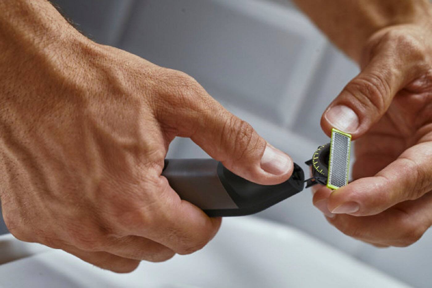 Left. Philips Norelco - OneBlade Pro 360, Face & Body Hybrid Electric Trimmer and Shaver - Chrome.