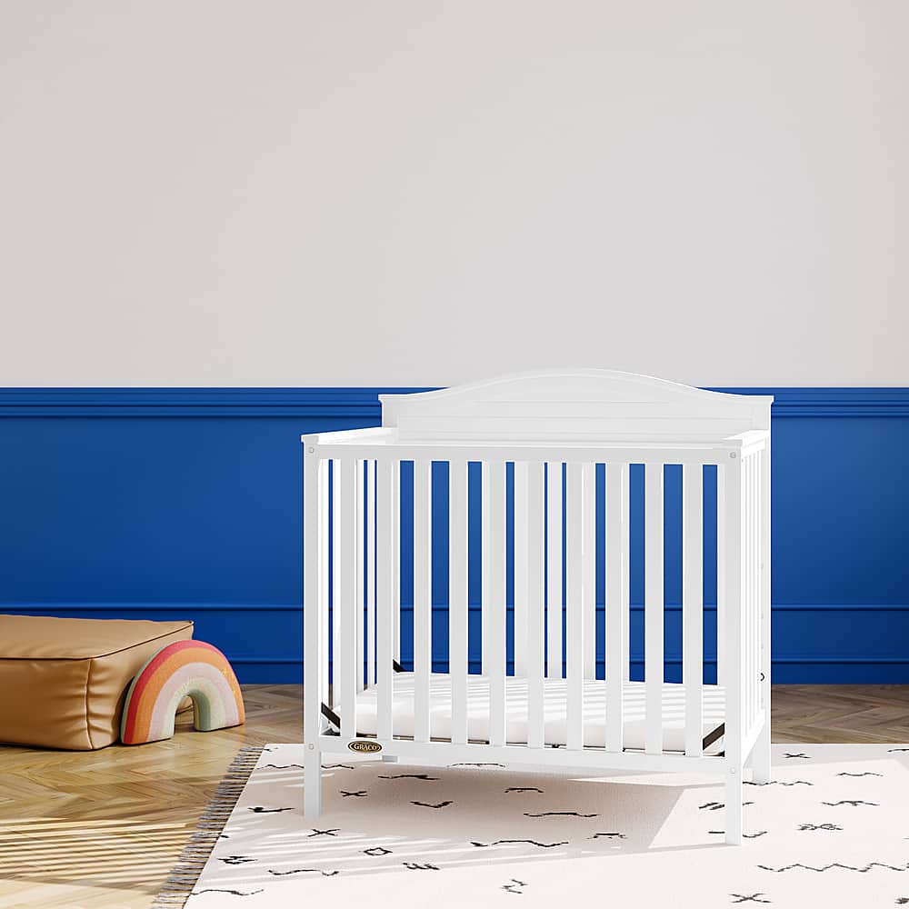 EvoNest 6-in-1 Portable Convertible Cradle To Mini Crib With Removable Wheels And Mattress Color: White