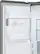 The image features a large, built-in, full-size refrigerator with a freezer section. The refrigerator is filled with various bottles, showcasing its spacious interior. The refrigerator is designed with a counter-depth style, providing a sleek and modern appearance.