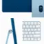 The image showcases a blue keyboard and a blue mouse, both of which are part of an all-in-one desktop computer. The keyboard has a compact design with a small footprint, making it suitable for space-saving setups. The mouse is also small and blue, complementing the overall aesthetic of the computer. The image highlights the blue color scheme of the keyboard and mouse, which gives the computer a sleek and modern appearance.