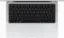 The image features a white laptop computer with a black keyboard. The keyboard is positioned in front of the laptop, and it appears to be a close-up shot of the keyboard. The laptop is likely a MacBook, as it is known for its sleek design and minimalist appearance.