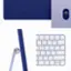 The image showcases a purple keyboard and mouse, which are part of an all-in-one desktop computer. The keyboard has a purple and white color scheme, and the mouse is also purple. The keyboard has a variety of keys, including letters, numbers, and function keys, as well as a dedicated key for the mouse. The mouse is designed to work seamlessly with the keyboard, providing a comfortable and efficient user experience.