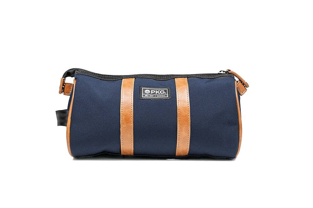 Angle. PKG - Charlotte Recycled Essentials Toiletry Bag - Navy/Tan.