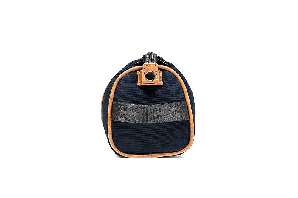Left. PKG - Charlotte Recycled Essentials Toiletry Bag - Navy/Tan.