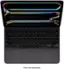 The image features a laptop computer with its keyboard open, showcasing the keys. The keyboard has a rainbow-colored strip on the top, adding a unique touch to the laptop. The keys are arranged in rows, with some of the most prominent ones being the letters A, S, D, F, G, H, J, K, L, and Z. The laptop is closed and ready for use, making it an attractive and functional device.