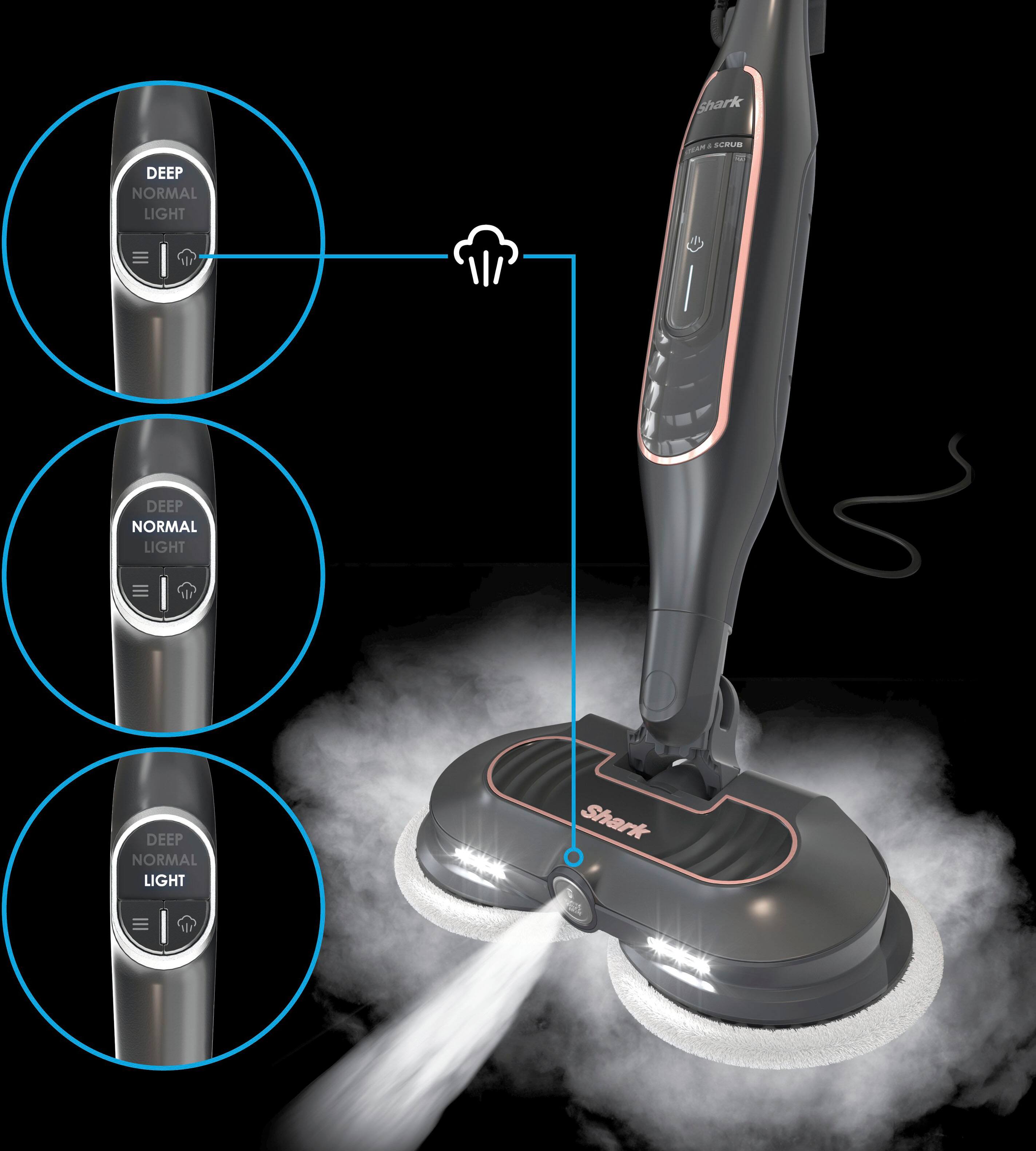 The image features a Shark vacuum cleaner with a rotating brush and a spray of water. The vacuum is designed to clean carpets and other surfaces with ease. The device has a light on the top, which indicates that it is in operation. The vacuum is equipped with a cord and a handle for easy maneuvering. The rotating brush helps to remove dirt and debris from the surfaces being cleaned.