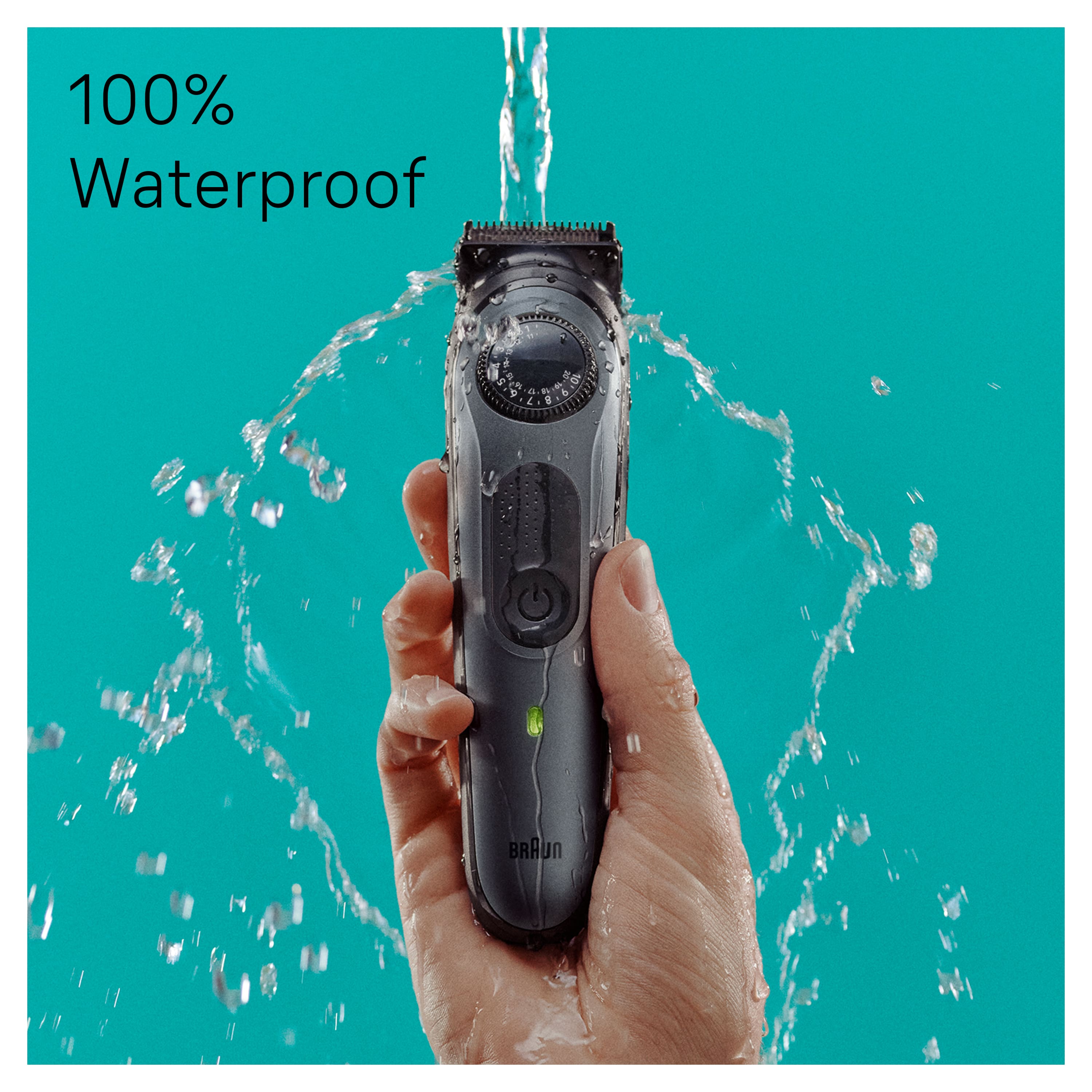 The image features a person holding a hair trimmer that is 100% waterproof. The trimmer is being used to cut someone's hair, and the person is holding it over a sink, which is filled with water. The waterproof feature of the trimmer allows it to be used safely and effectively in wet environments, such as a bathroom or near a sink.