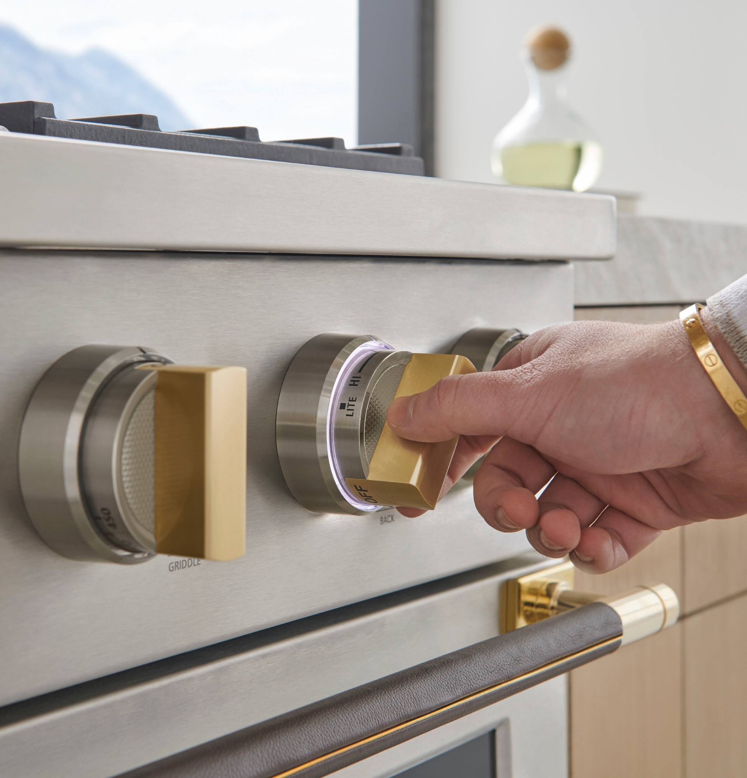 Left. Monogram - The Designer Collection Handle for 36" Pro Range - Brass.