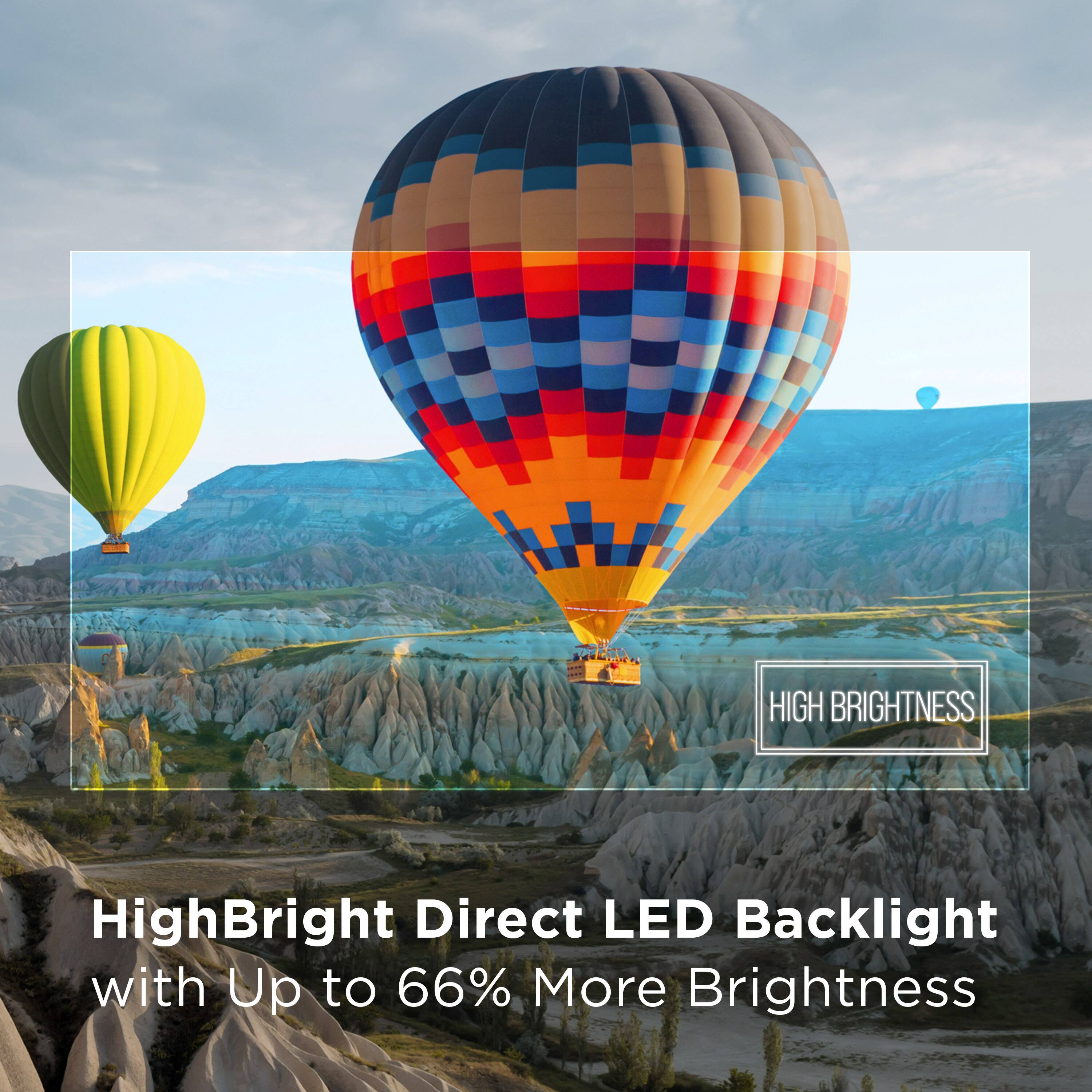 The image features a large, colorful hot air balloon floating in the sky. The balloon is prominently displayed in the foreground, with a mountainous landscape in the background. The scene is visually appealing and captures the essence of adventure and exploration. The image is categorized as "Televisions," but it does not show any televisions or related products. Instead, it highlights the vibrant colors and the sense of freedom associated with hot air balloons.