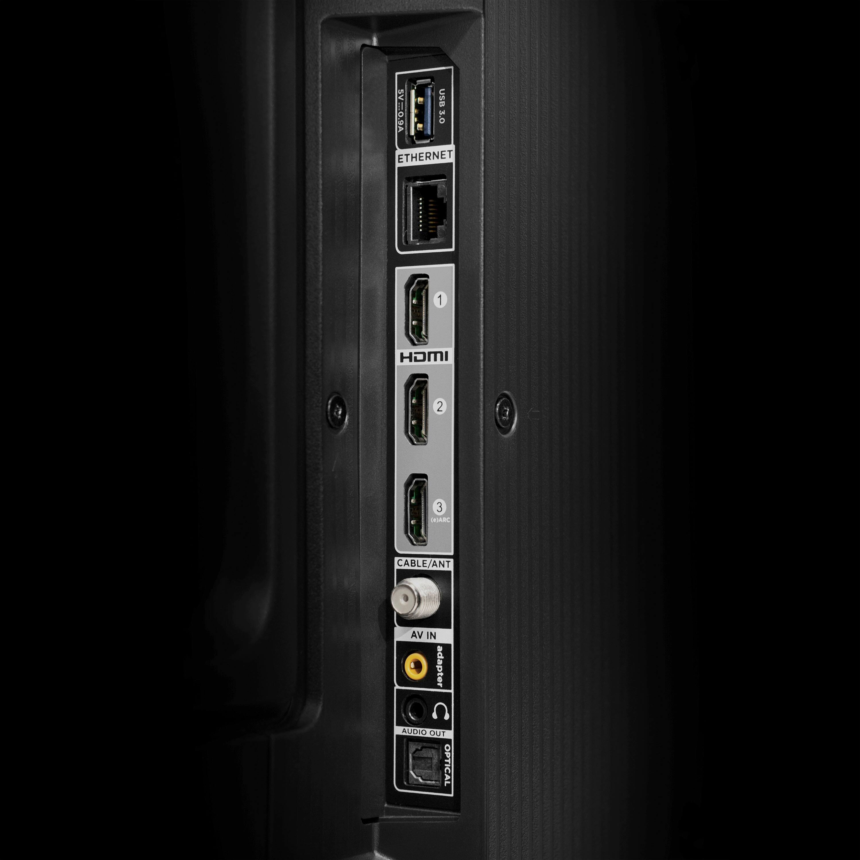 The image features a back of a computer monitor with a variety of ports and connections. There are two USB ports, one on the left side and another on the right side. Additionally, there are two Ethernet ports, one near the top left corner and another near the top right corner. A HDMI port is also present, located in the middle of the monitor. The monitor also has an audio port on the left side and an optical port on the right side. The image is dark, which highlights the various ports on the back of the monitor.