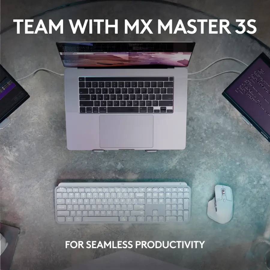 TEAM WITH MX MASTER 3S - FOR SEAMLESS PRODUCTIVITY

In the image, there are two laptops and a keyboard on a table. The laptops are placed on either side of the keyboard, which is in the center of the table. The arrangement suggests that the devices are being used for work or collaboration purposes. The image also includes a mouse, which is placed near the right side of the table. The overall scene conveys a sense of teamwork and productivity, with the laptops and keyboard as essential tools for achieving seamless work.