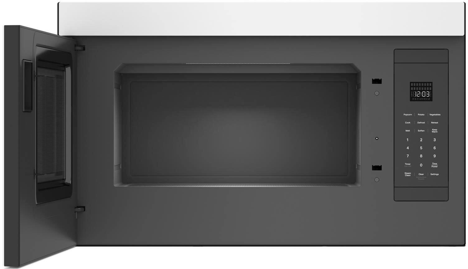 The image shows a microwave with two plates of food inside. The microwave is open, revealing the food. The food consists of broccoli and carrots, which are placed on separate plates. The microwave appears to be a modern, sleek design, and the food is being heated or cooked inside.
