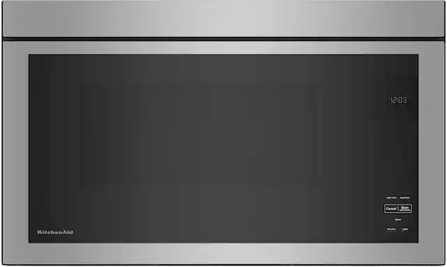 The image features a stainless steel microwave oven with a black screen. The microwave is currently empty, with no food items inside. The time displayed on the screen is 12:03.