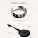The image features a ring and a charger, both of which are part of the Oura Ring Gen3. The ring is a silver ring with a small screen, while the charger is a USB cable. The ring and charger are placed next to each other, showcasing their compatibility and functionality.