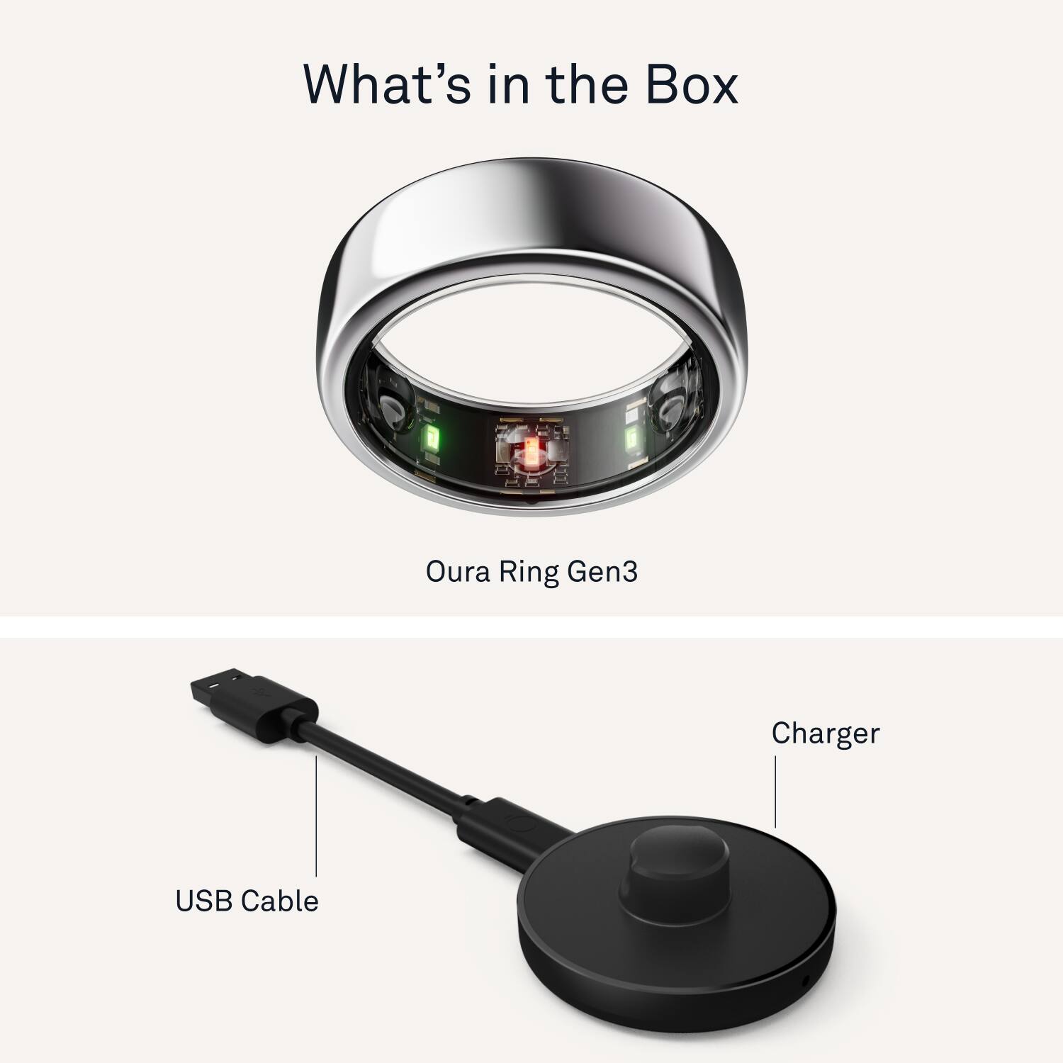 The image features a ring and a charger, both of which are part of the Oura Ring Gen3. The ring is a silver ring with a small screen, while the charger is a USB cable. The ring and charger are placed next to each other, showcasing their compatibility and functionality.