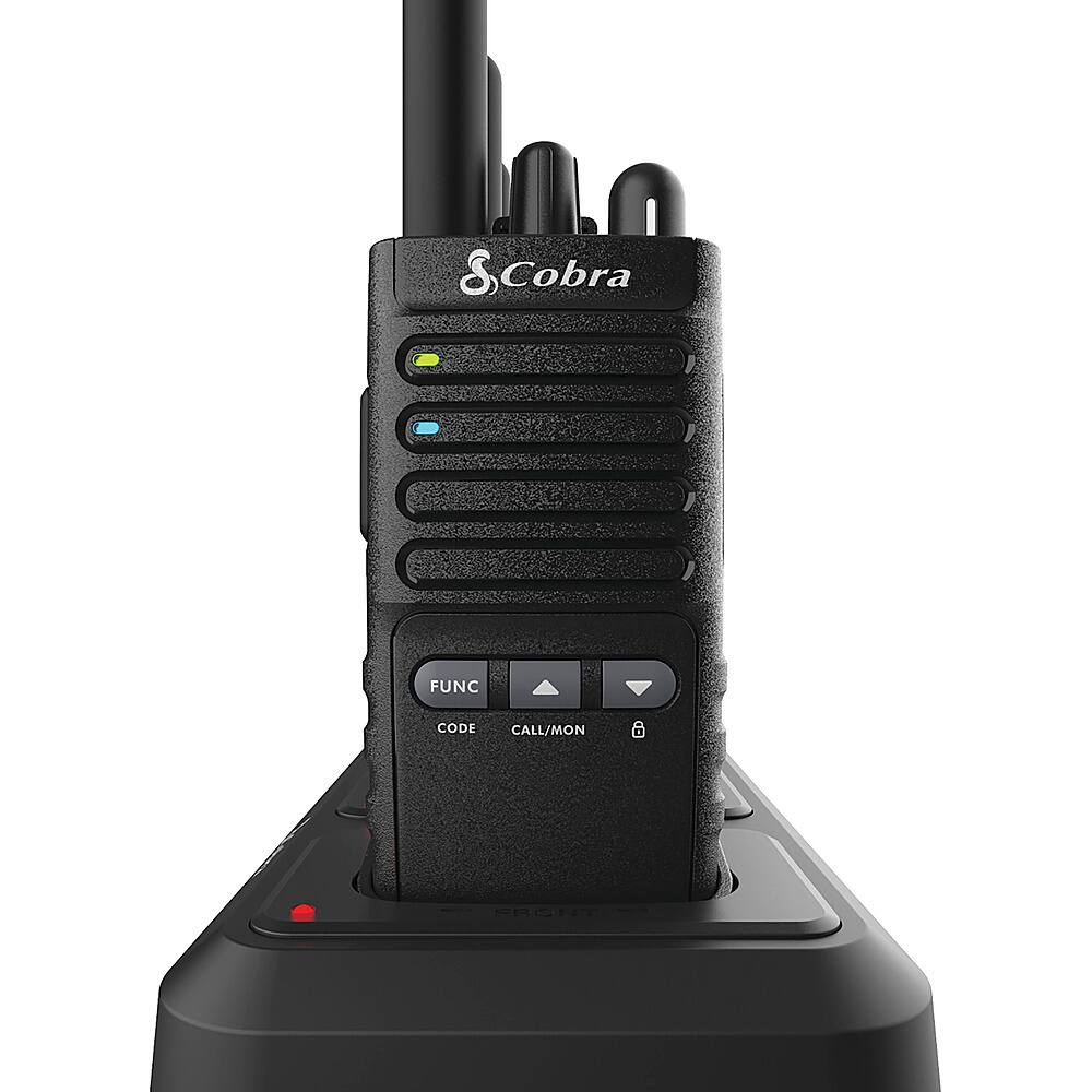 The image features a black Cobra radio with a red button on the front. The radio is designed for use in various situations, such as on a boat, in a car, or during outdoor activities. The radio is equipped with a microphone and speaker, allowing for clear communication during emergencies or while on the go. The radio also has a flashlight function, which can be useful in low-light situations. Additionally, the radio is waterproof, making it suitable for use in wet environments.