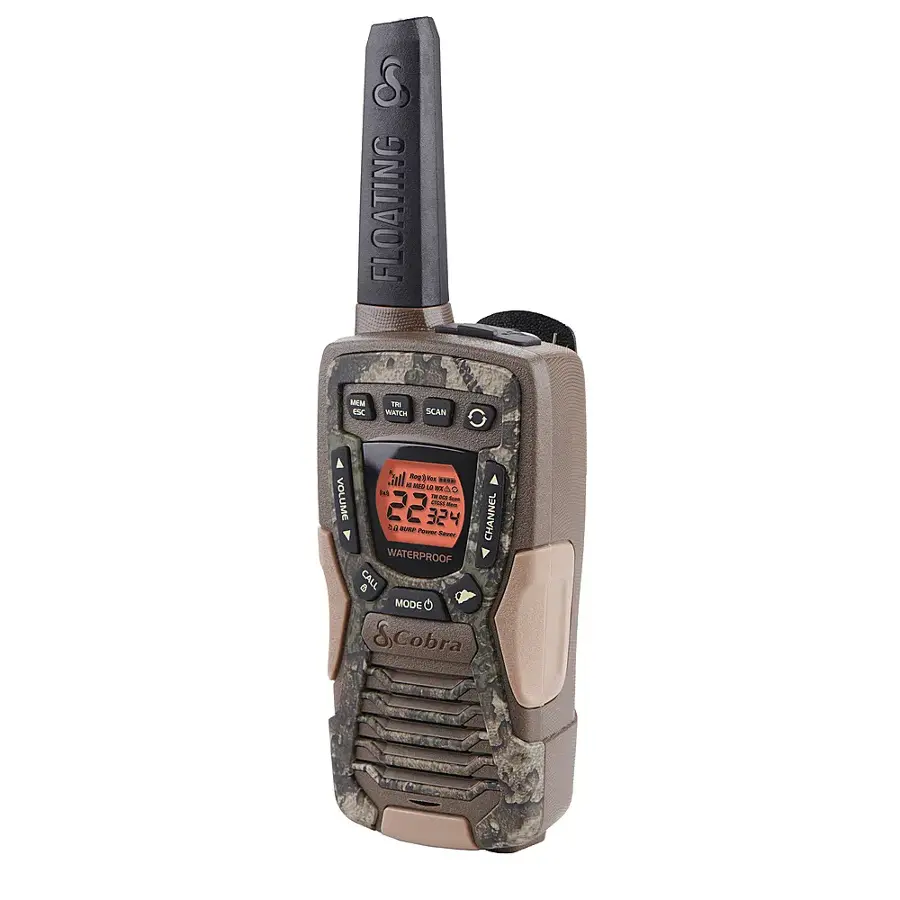 The image features a waterproof radio with a floating feature. The radio is designed to be used in water and is equipped with a built-in speaker and microphone. It is also waterproof and has a floating feature, making it ideal for use in water-related activities. The radio is made by Cobra and is available in a camouflage pattern.