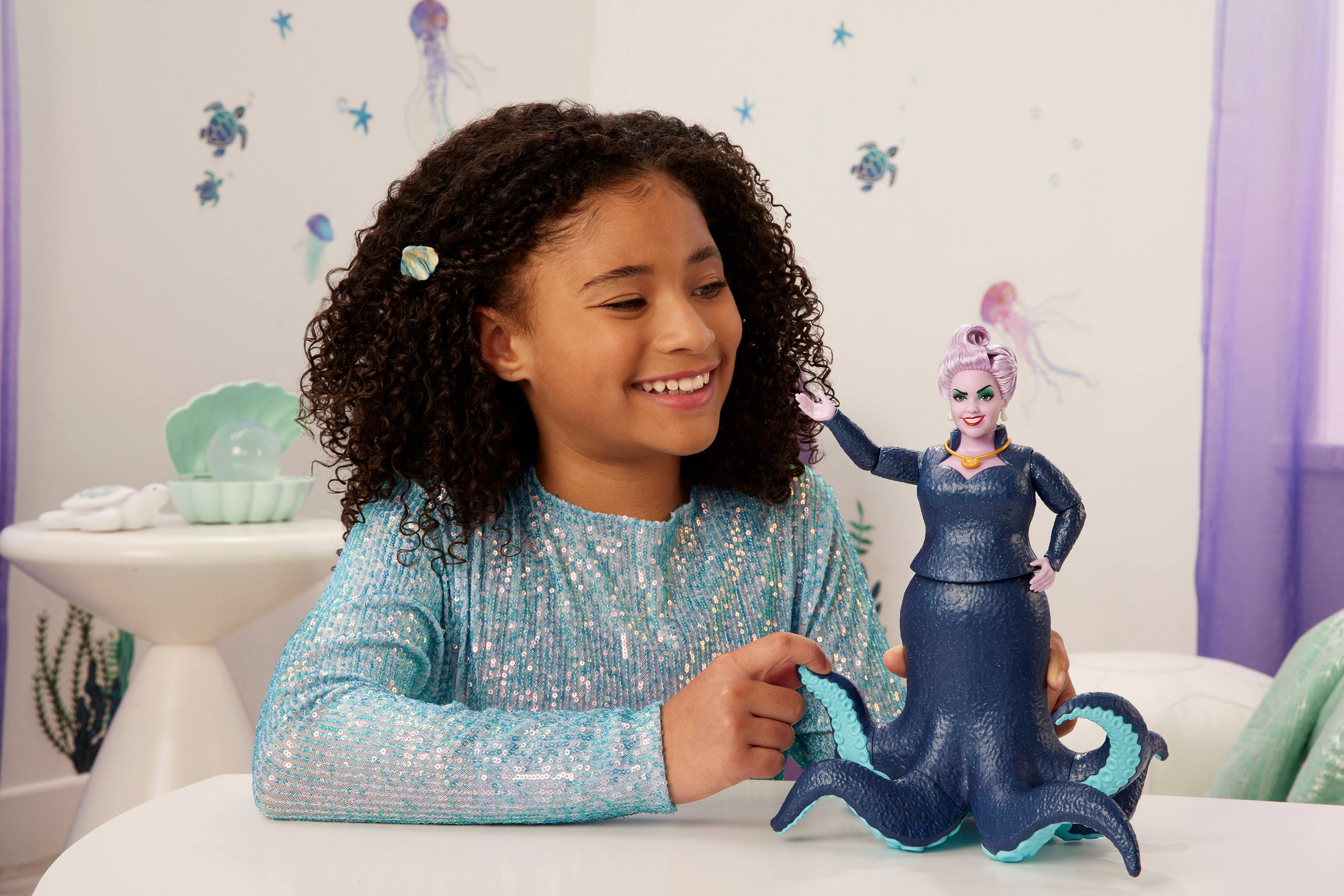 Left. Disney - The Little Mermaid Ursula Fashion Doll.