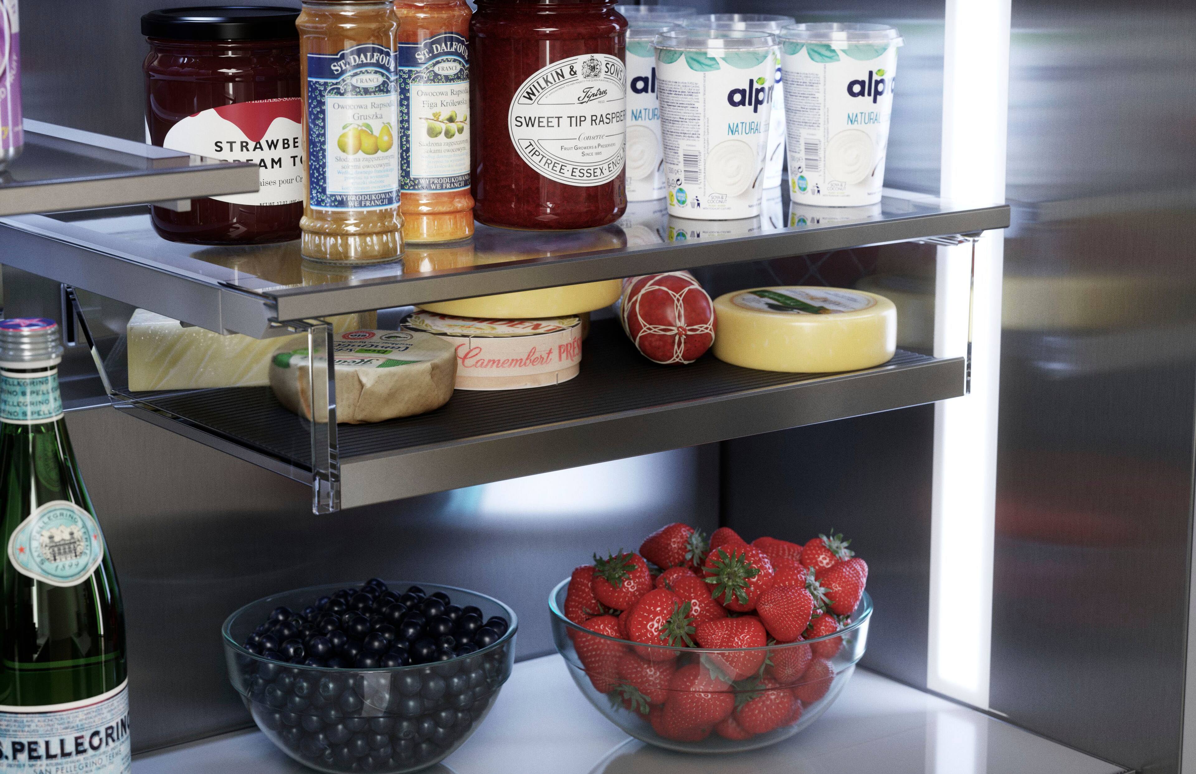 The image features a refrigerator with various food items and drinks. There are several bottles, including one labeled "alp" and another labeled "Pellegrino." A bowl of strawberries is also present, as well as a container of blueberries. Additionally, there are two jars of jam and a container of yogurt. The refrigerator is well-stocked with a variety of food and drink options.