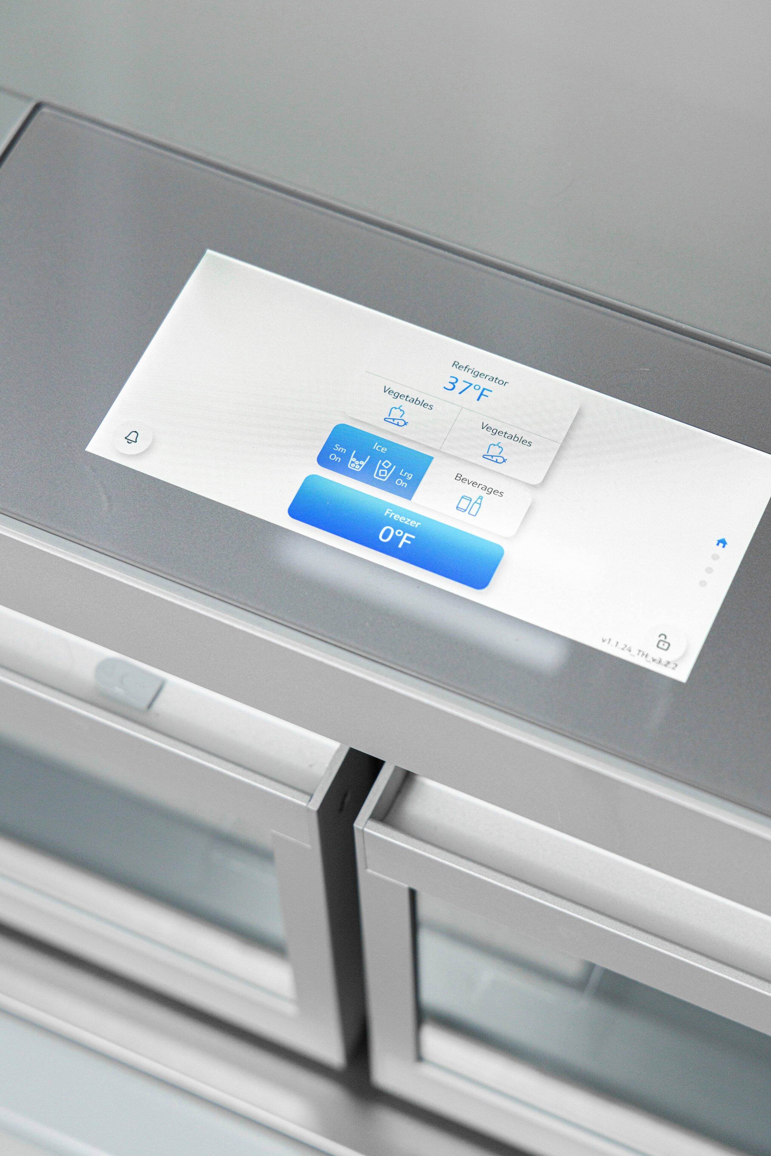 The image shows a refrigerator with a digital display on the door. The display shows the current temperature inside the refrigerator, which is 37 degrees Fahrenheit. The display also indicates that the refrigerator is set to keep the vegetables at 37 degrees Fahrenheit, while the beverages are set to be kept at 0 degrees Fahrenheit. The refrigerator is also equipped with a freezer, which is set to keep items at -27 degrees Fahrenheit.