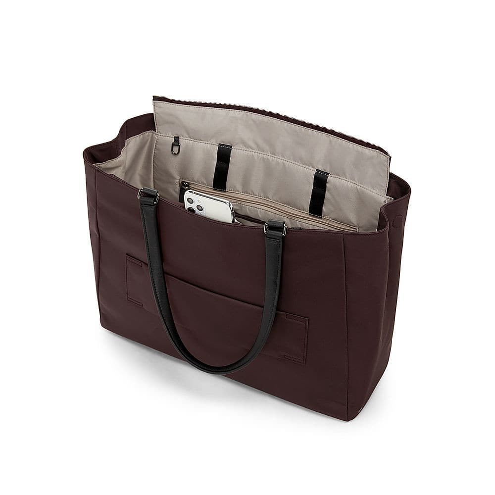 Left View: TUMI - Voyageur Valetta Large Tote - Deep Plum